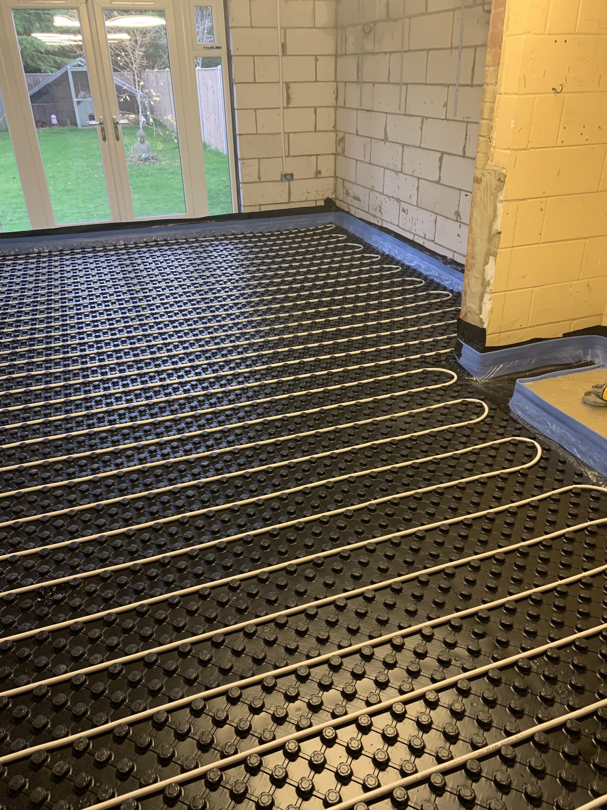 Underfloor heating pipes laid in a new room